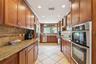 Updated Kitchen with Cherry Wood Cabinetry