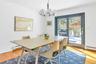 Dining room featuring a chandelier, hardwood / wood-style floors, and baseboard heating
