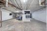 Unfinished below grade area featuring electric panel