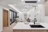 Kitchen with a sink, open floor plan, light countertops, recessed lighting, and decorative light fixtures