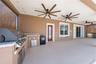Outdoor kitchen w/ new grill.