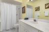 Guest bathroom with tub/shower combination.
