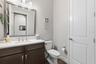 Half bath located off of the main living room and kitchen is convenient for guest so that they do not have to go through any of the bedroom areas.