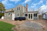 Rear view of house with french doors, outdoor lounge area, a patio area, a chimney, and a sunroom