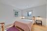 Bedroom with wood finished floors and recessed lighting