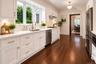 Staged - wood floors, granite counters, double oven and gas stove top