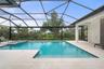 One of the most extraordinary features of the property is the spectacular screened outdoor living space designed to fully embrace Florida’s year-round