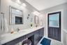 Spacious en-suite bathroom with access to the pool area