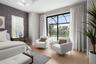 The sliding glass doors are adnored with custom drapery.