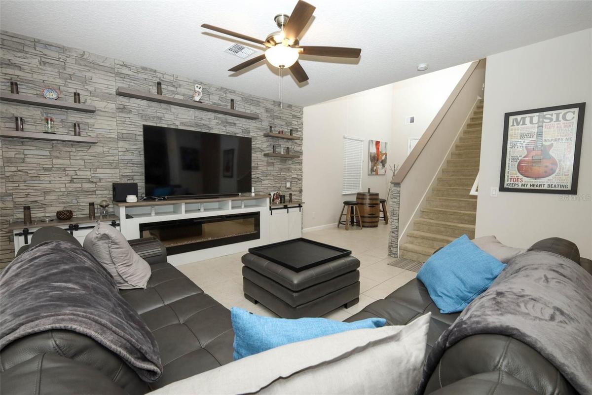 Great room / Custom built entertainment center / electric fireplace