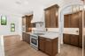 SHOWS THE BUTLERS PANTRY TUCKED RIGHT BEHIND THE KITCHEN, AND A HUGE DINING AREA TO THE SOUTH OF THE KITCHEN FOR PERFECT CONVENIENCE!