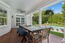 covered porches for al fresco dining, and a fire-pit for evening gatherings