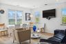 Living room featuring plenty of natural light and visible vents
