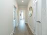The bedroom corridor is thoughtfully set apart, ensuring a distinct separation from the main living area for added privacy and tranquility