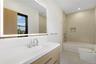 Bathroom with vanity and washtub / shower combination