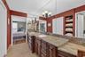 Primary bathroom with walk in closet and extra storage