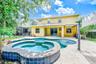 Oversized hot tub featuring power water jets, foot bubbler, water fall spillover and gas heater.