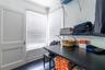 Primary bedroom closet with convenient laundry room built in!