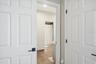 View of Jack and Jill bathroom from 3rd bedroom- walk in closet on right.