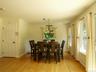 Lots of sunlight with large full windows overlooking the backyard, deck and wooded area.