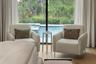 The spacious primary suite has plenty of room for relaxation after a day on the boat or at the pool!