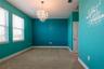 Bedroom 3 with a walk-in closet.