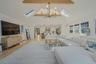 Living room with a skylight, high vaulted ceiling