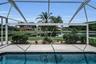 Custom Panoramic pool screen showing view of pond from pool