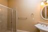 Full bath attached to first floor bedroom with walk-in shower