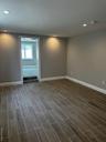 Spare room featuring wood finish floors and recessed lighting