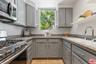 U-shaped kitchen featuring gre
