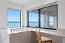 Open water view from the primary bathroom and soaking tub with jets