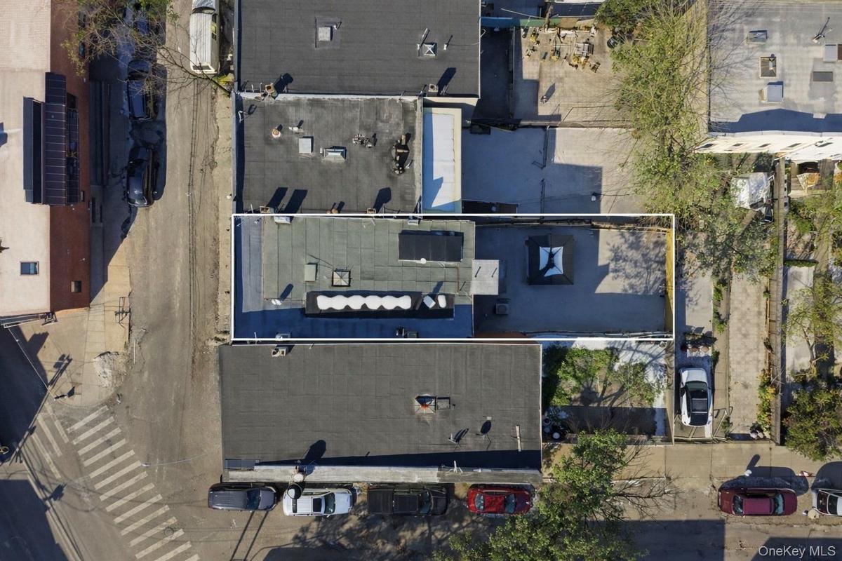 Aerial view of top of building showing solar panels