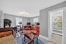 Office with a baseboard heating unit, plenty of natural light, and light wood-type flooring