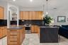 Updated kitchen with solid white Oak cabinets that have soft close doors and pull-outs, Dekton counters with waterfall edge, stainless appliances incl