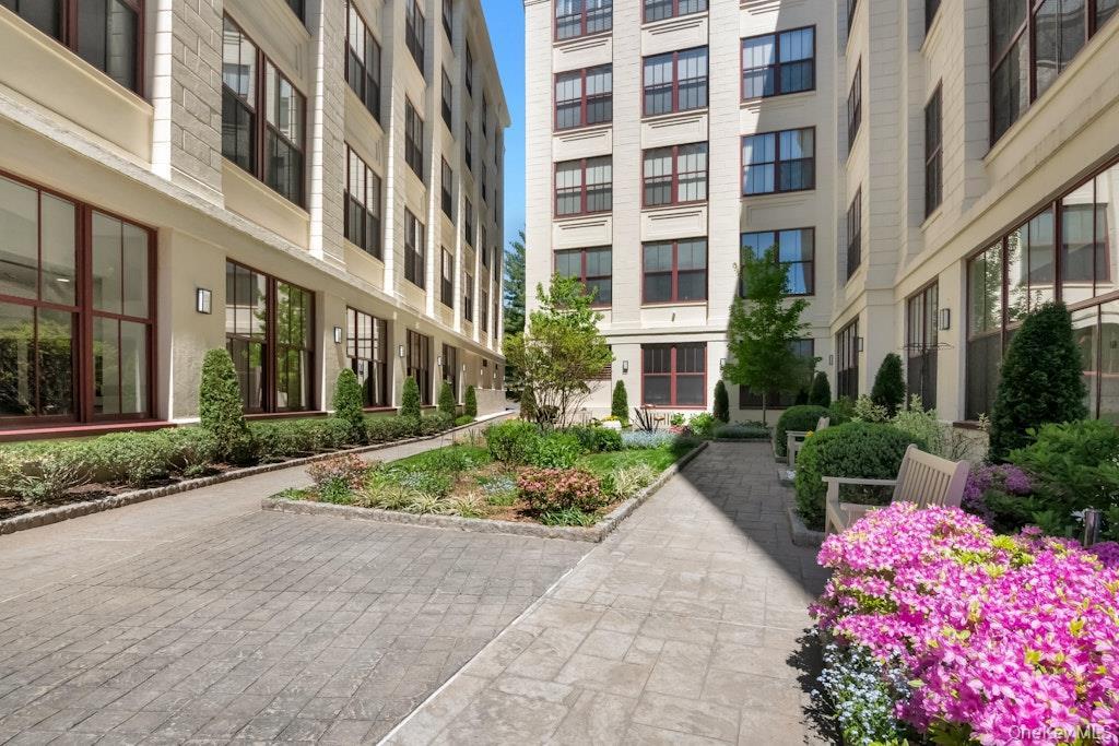 Enjoy relaxing in serene floral courtyard