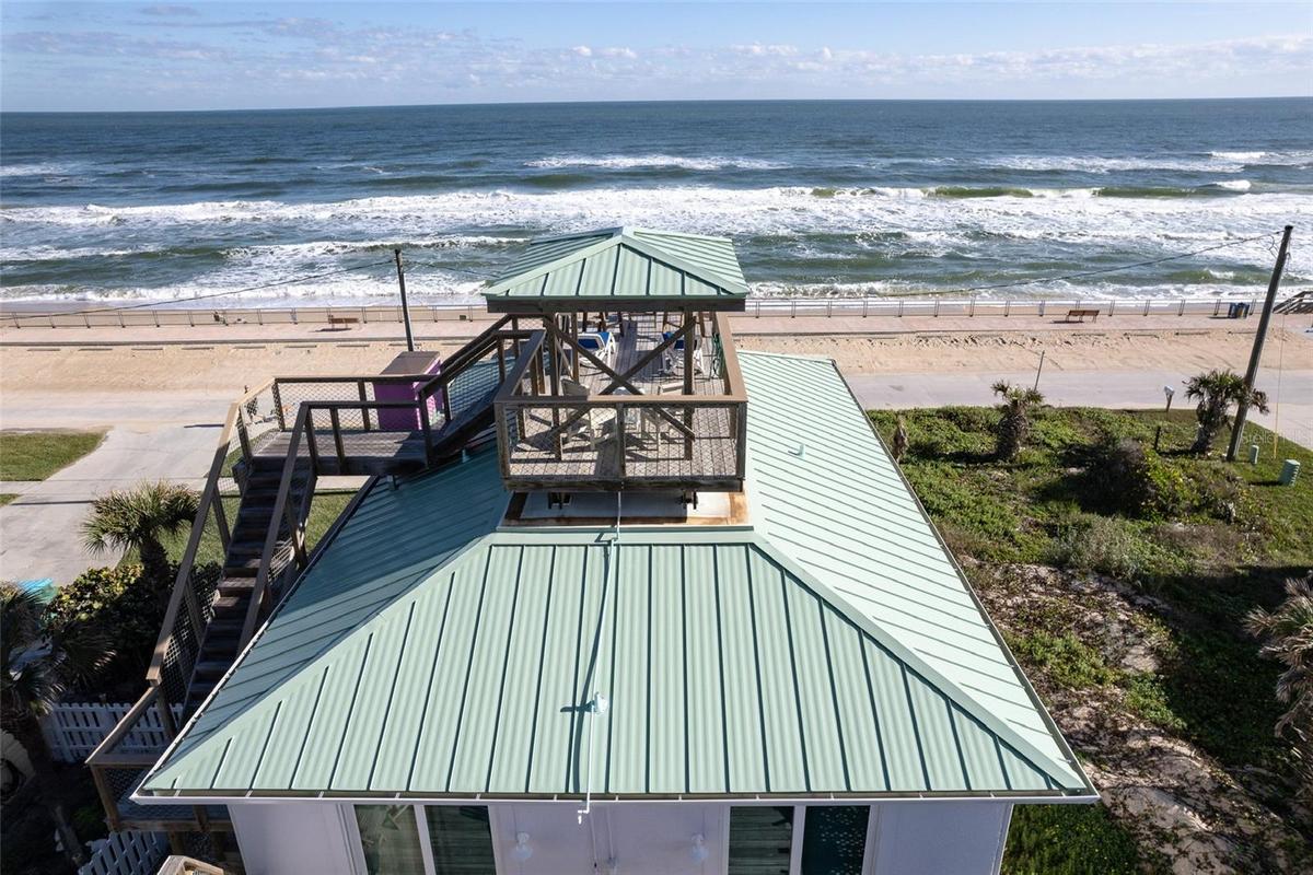 Oceanview Observatory. Birds eye view of rocket launches, surfers and marine life, as far as the eye can see...
