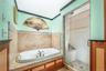 Bathroom with a bath, a shower stall, ornamental molding, and recessed lighting