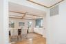 Hallway featuring light wood-style floors and coffered ceiling