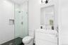 Full bath featuring a stall shower, vanity, and recessed lighting