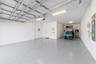 GOLF CART INCLUDED Spacious garage with golf cart parking and epoxy flooring