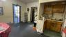 Kitchen featuring a baseboard heating unit, sink, and a drop ceiling