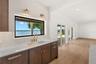 ENJOY PANORAMIC POOL AND LAKE VIEWS FROM THE KITCHEN SINK