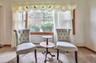 Sitting room featuring carpet floors and a baseboard radiator