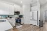 Upgraded appliances, designer cabinet knobs and pulls plus a walk in pantry makes this kitchen very functional.