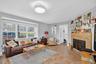 Living room with stone finish floors and baseboards
