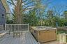 Wooden terrace with a hot tub