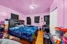 Bedroom with wood finished floors