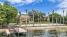 Sandy beach and dock with boat lift and 2 jet ski lifts