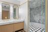 Men’s and women’s fitness locker room vanity areas with premium finishes